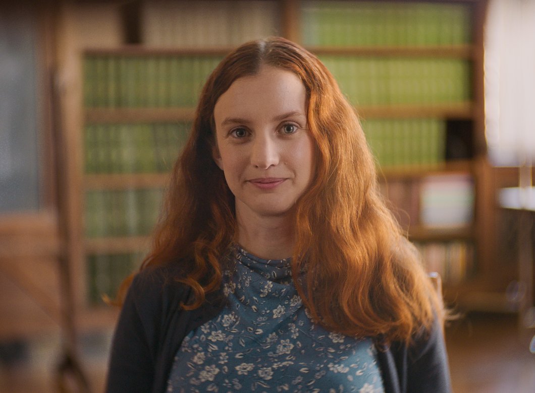 A person smiles for a photo