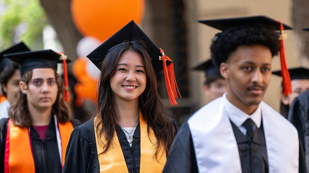 Three Caltech students enter the commencement ceremony