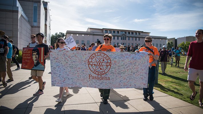 Board members from the Caltech Postdoctoral Association and the Graduate Student Council led marchers from Beckman Lawn to Memorial Park, carrying a banner signed by hundreds of members of the local community to express their support for science.