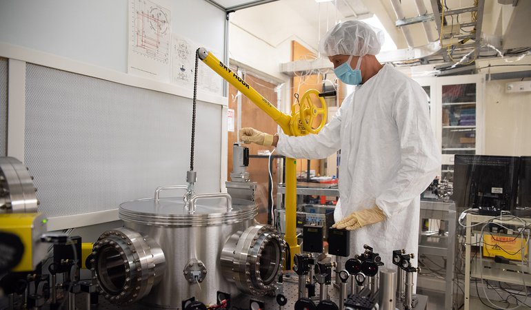 The air is pumped out of the chamber.