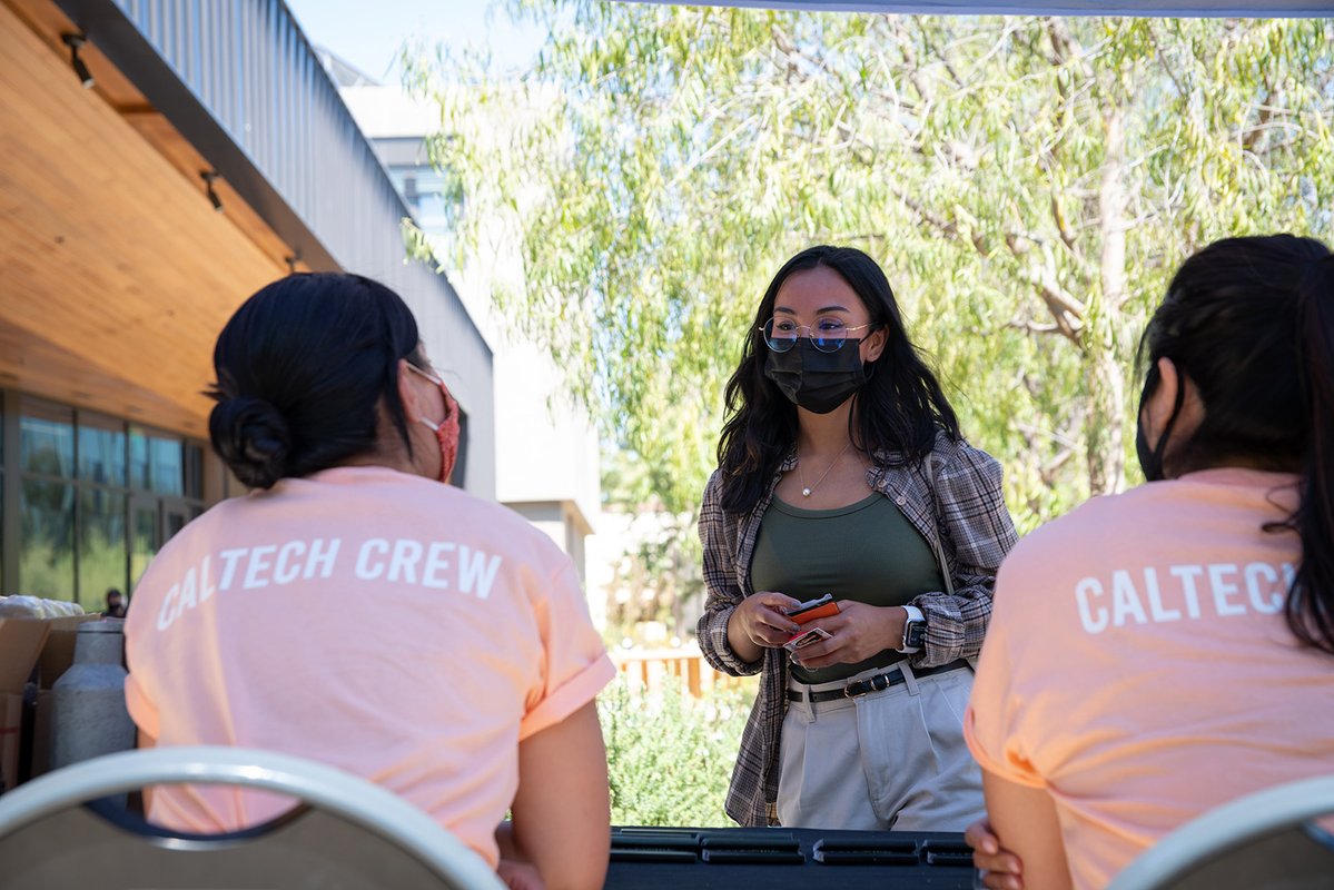 Katie Ann Huy checks in at a registration table.