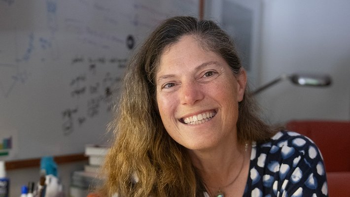 Victoria Orphan sits in her office