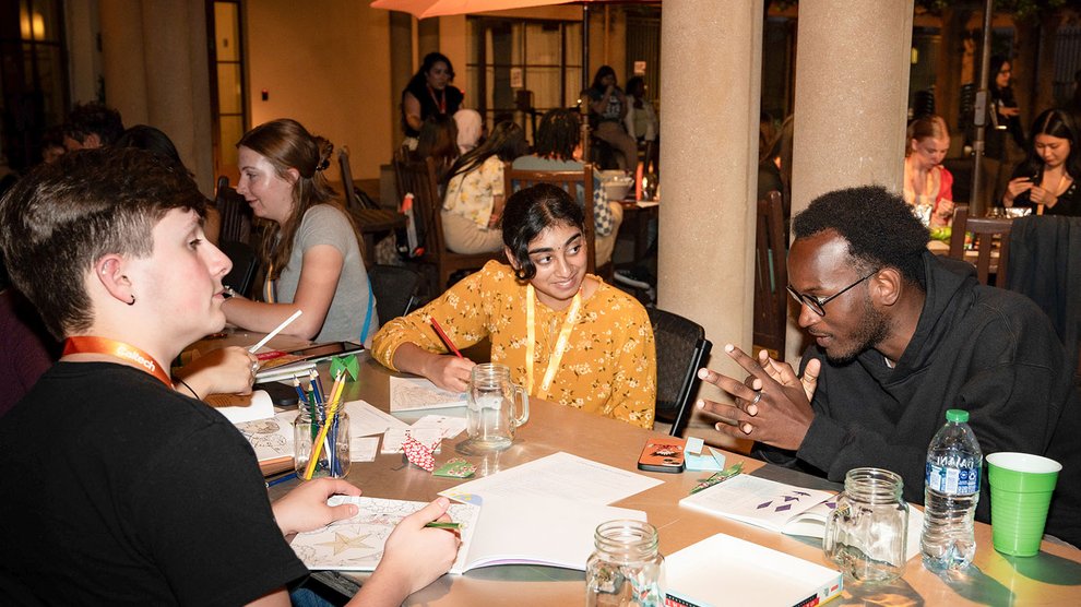 Students talk over crafts.