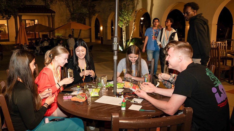 Students talk over snacks and crafts