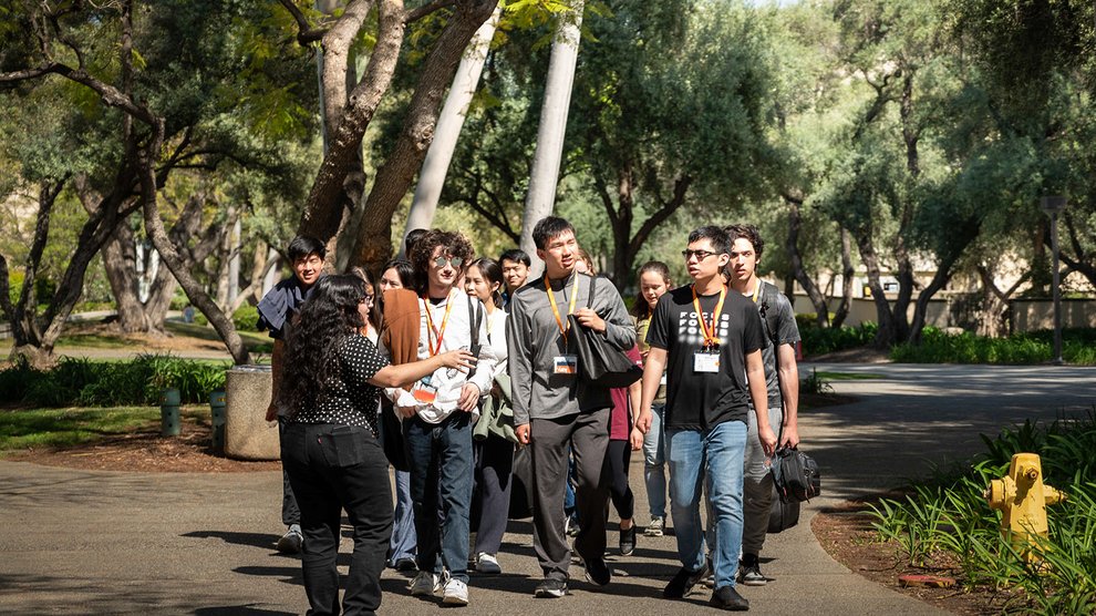 A group of students on a walking tour through campus.