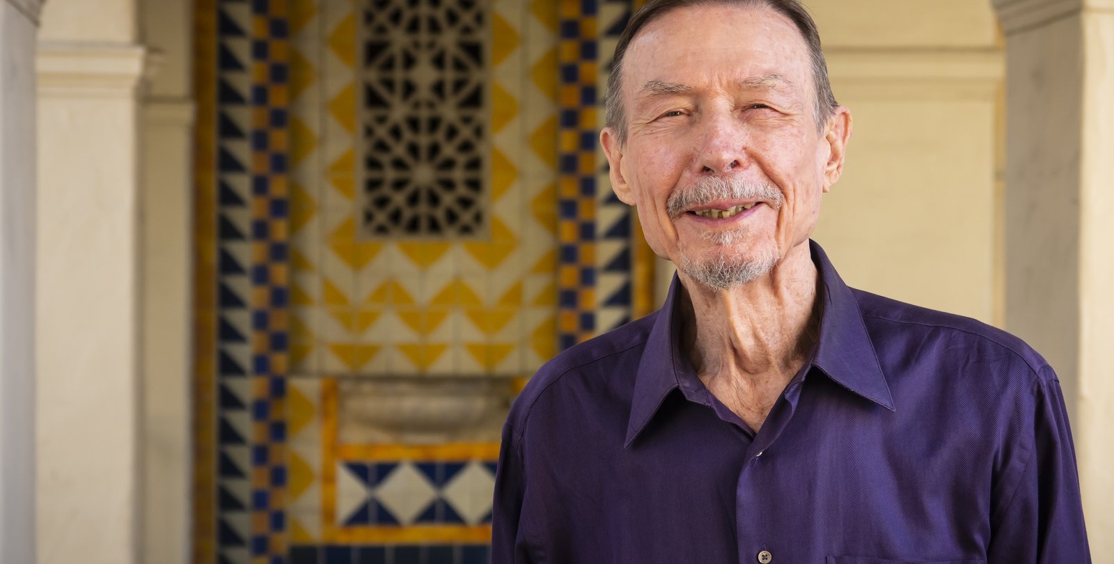 image of carver mead wearing a purple button down shirt