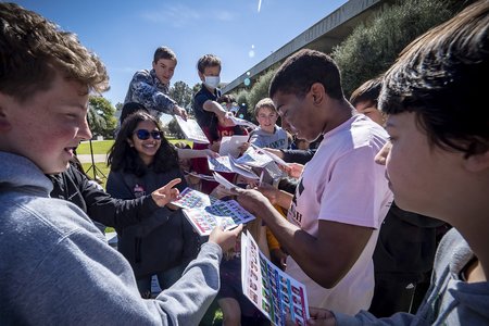Students from Sierra Madre Middle School ask an ME72 student for autographs