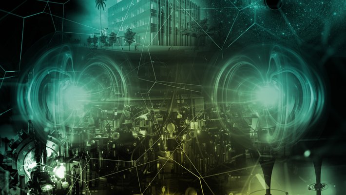 A duotoned green montage includes quantum physics experimental equipment, images related to fundamental physics and astrophysics, and a preliminary building concept.