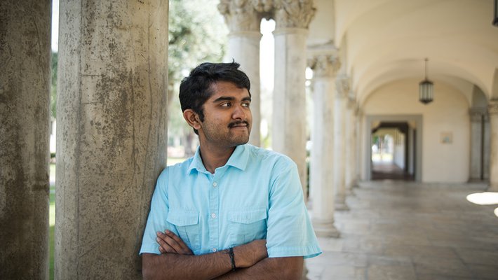 Senior Aadith Moorthy leans against a pillar