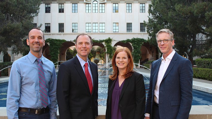 photo of Adam Schiff and panelists before town hall meeting at Caltech
