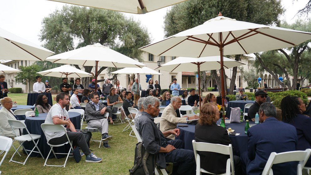 The Venerable family and other members of the Caltech community listen to speakers at the ceremony.