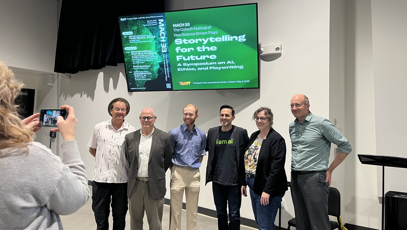 A person takes a photo of a group