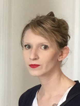 A person with blond hair poses for a headshot