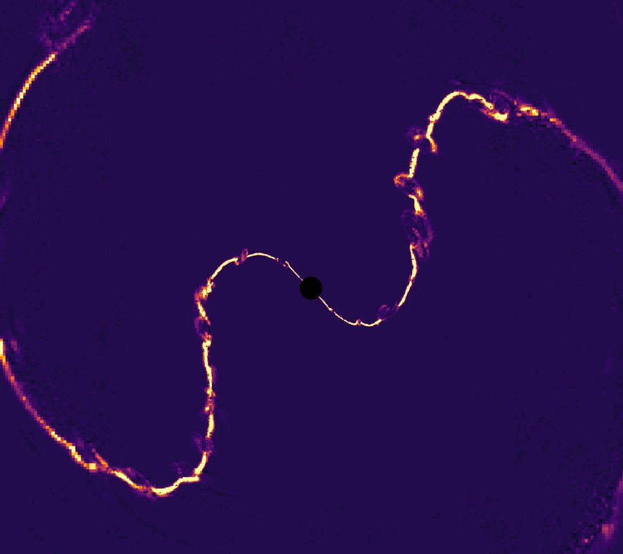 Yellow electric current lines are seen in this simulation image, whipping around a black hole.