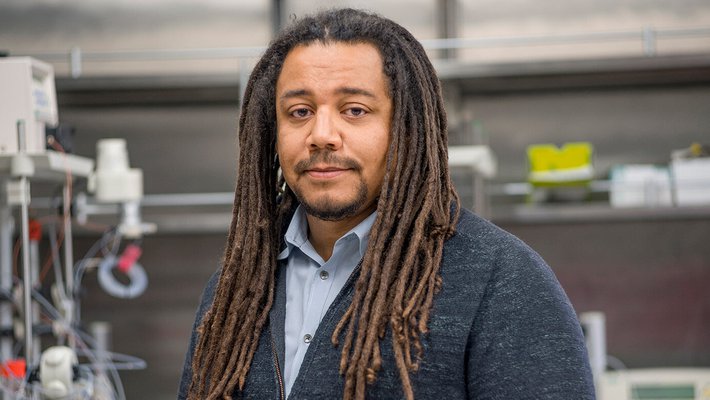 Professor Clemons in his lab with equipment in the background
