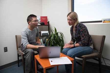 STEM writing specialist Christina Birch during a tutoring session with a student in the Hixon Writing Center.