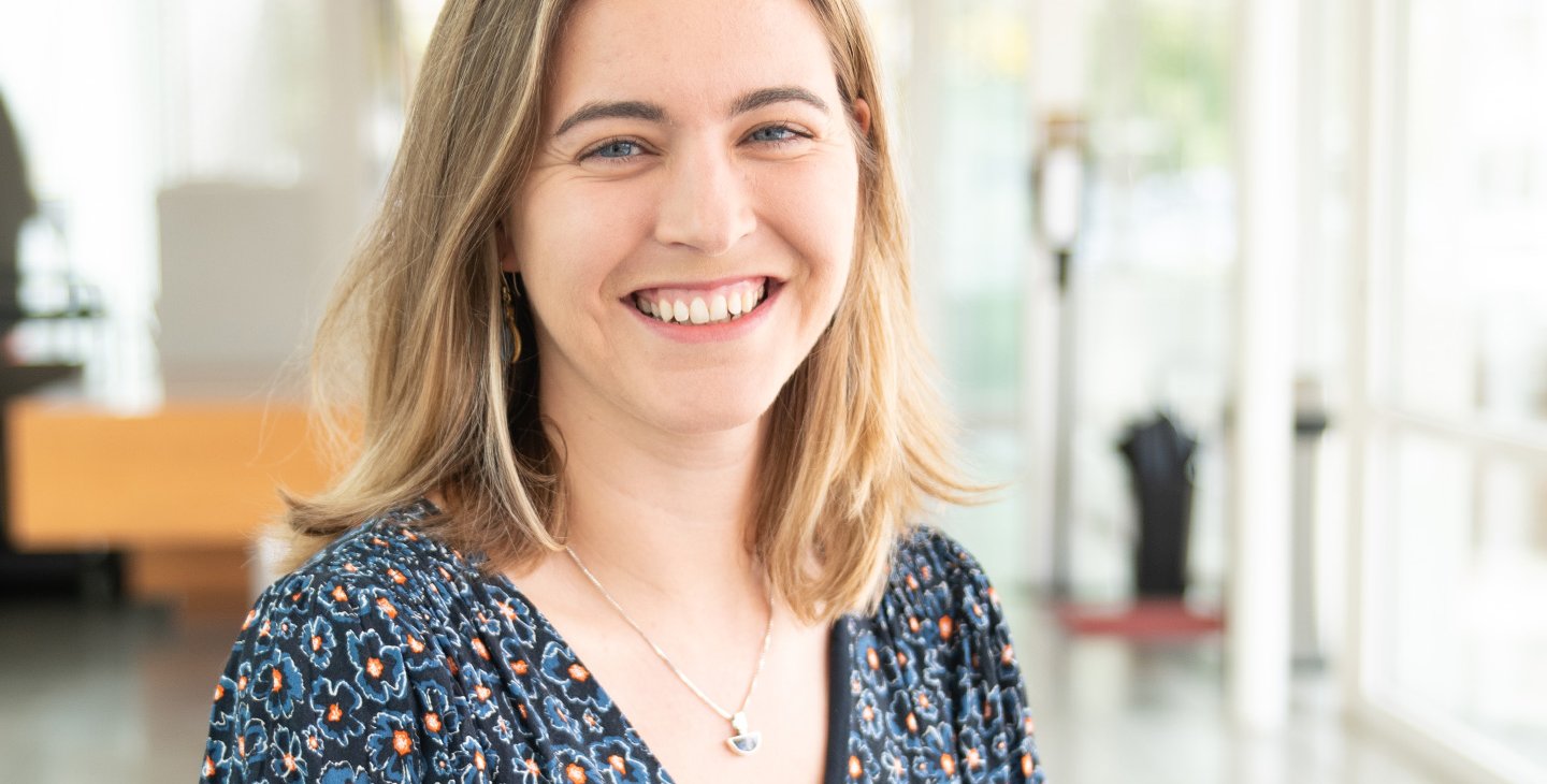 A person smiles for a photo