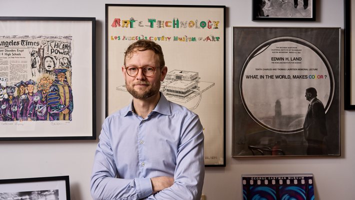 Image of Brian Jacobson in office wearing a light blue button-down shirt