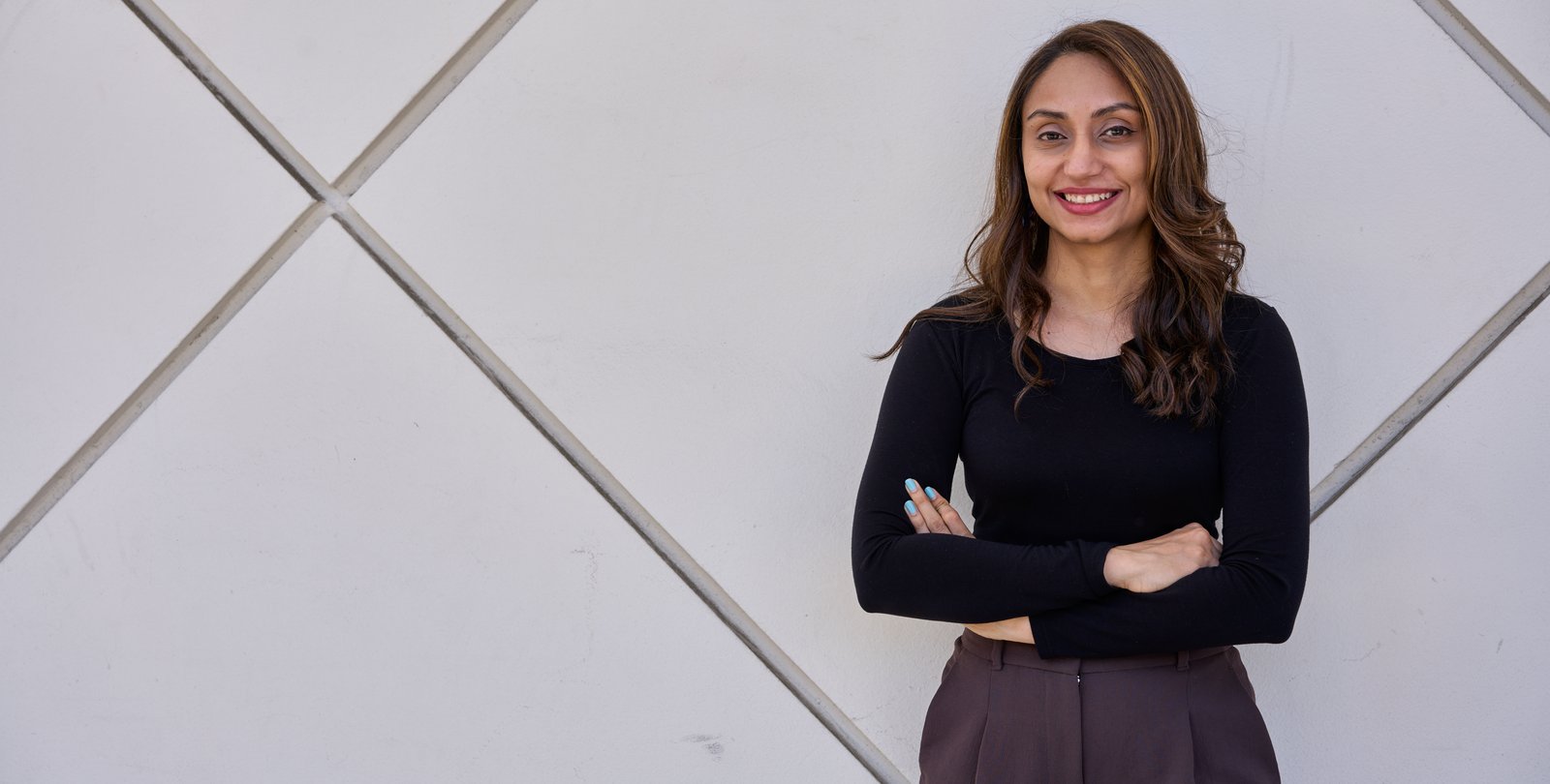 image of smruthi karthikeyan in black top against white background of beckman auditorium