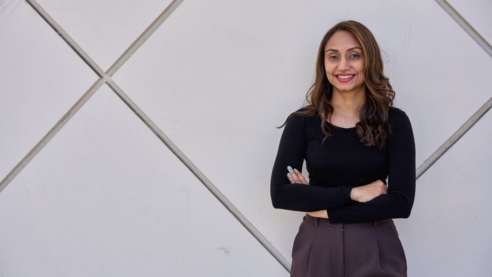 image of smruthi karthikeyan in black top against white background of beckman auditorium