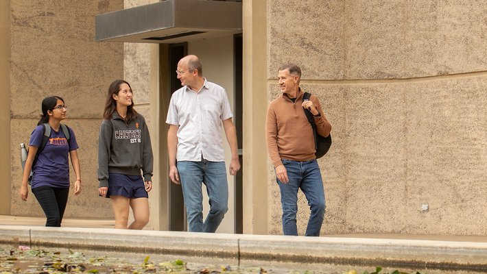 Michael Alvarez and Frederick Eberhardt with group