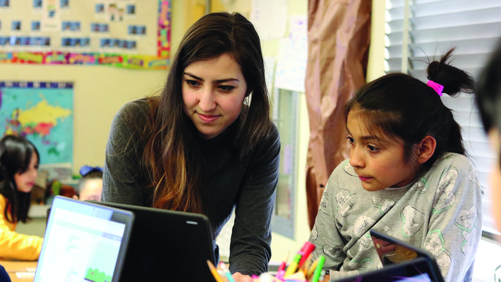 A Caltech computer science student helps a Pasadena third grader learn to code.