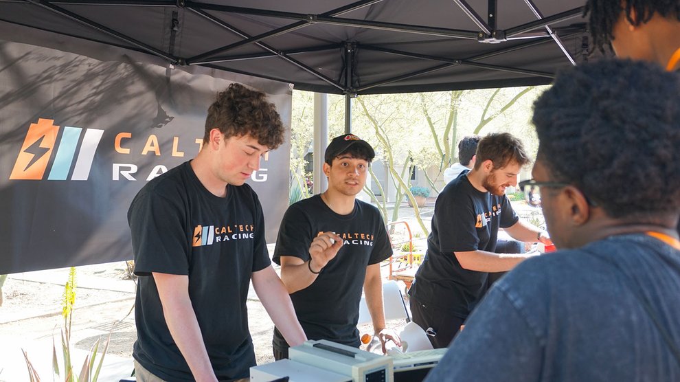 Students from the Caltech Racing Club talk with admitted students