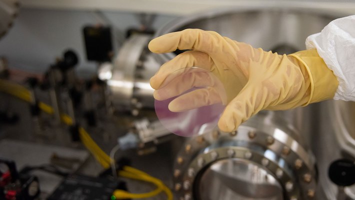 Pinkish mirror coating on a test disk.