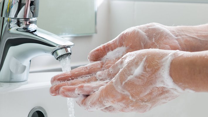 Photo of hand washing.