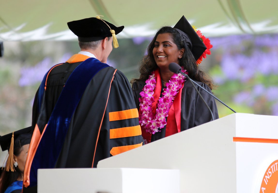 Caltech president Thomas F. Rosenbaum congratulates Sakthi Vetrivel, who was awarded the Mabel Beckman Prize