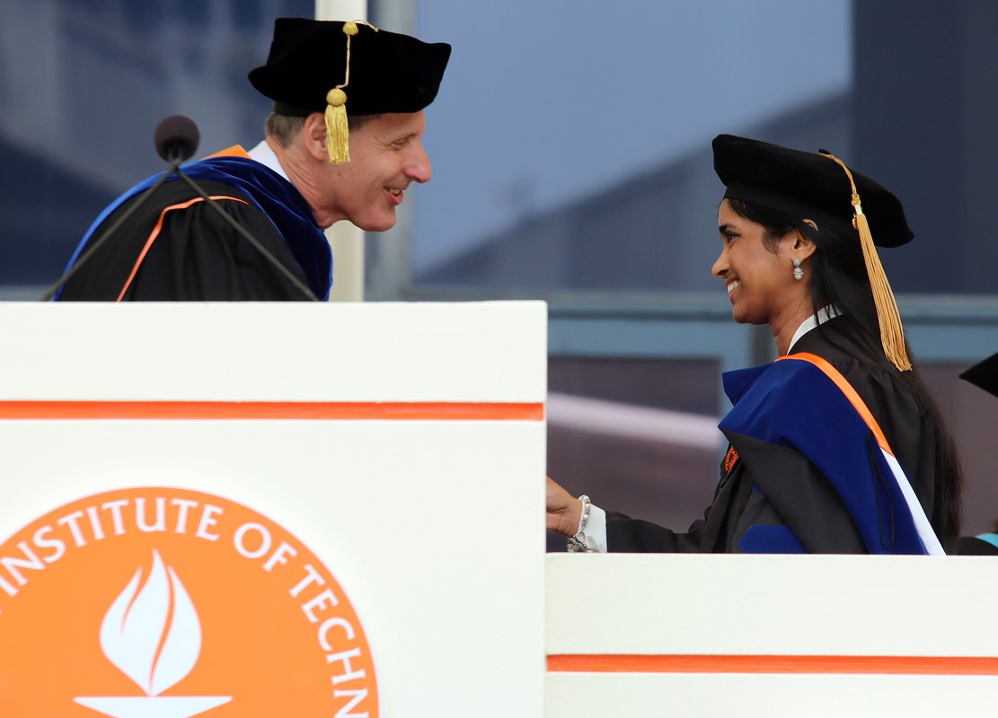 Caltech president Thomas F. Rosenbaum congratulates Anupama Lakshmanan, this year’s recipient of the Milton and Francis Clauser Doctoral Prize