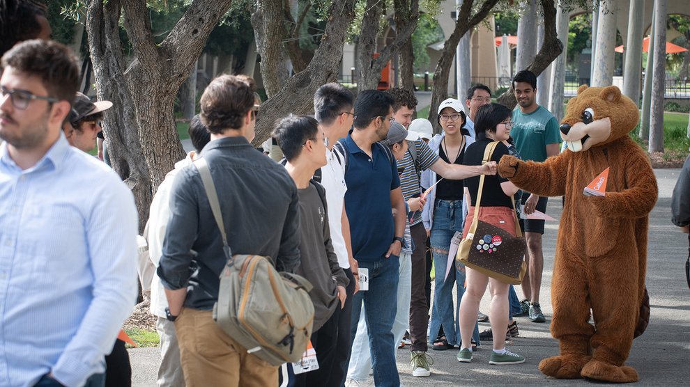 Students meet Berni the Beaver before Convocation