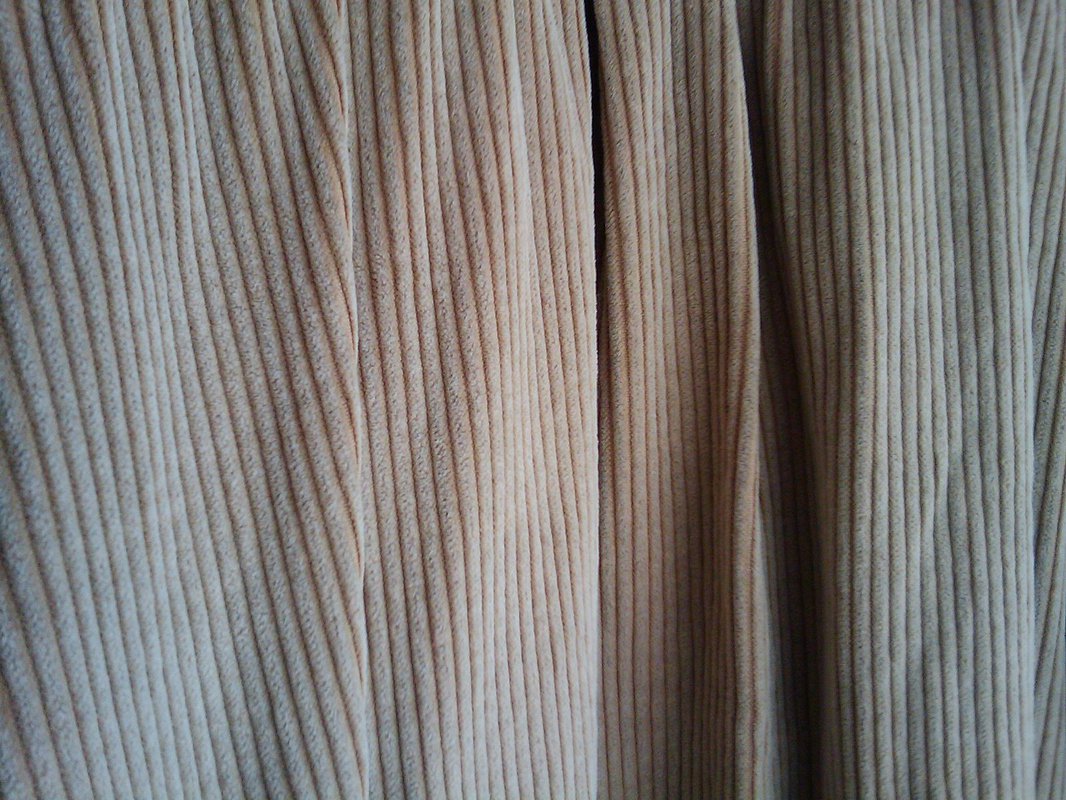 An image of somewhat rumpled corduroy fabric.