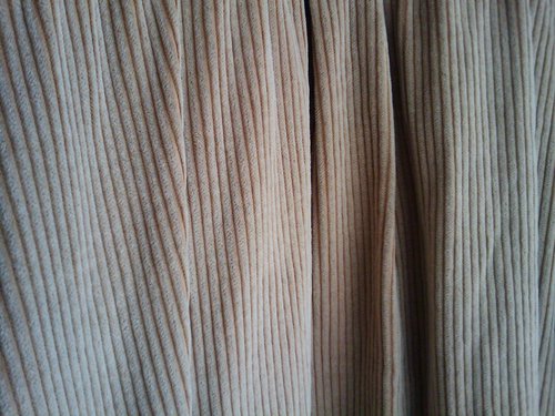 An image of somewhat rumpled corduroy fabric.