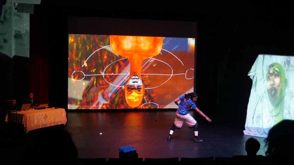 Meena Murugesan (left, behind table) and Brianna Mims (right) in "Parable of the Pathmakers"