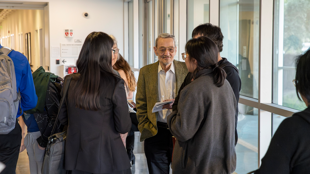 Robert Loschke chats with students at the post-competition reception.