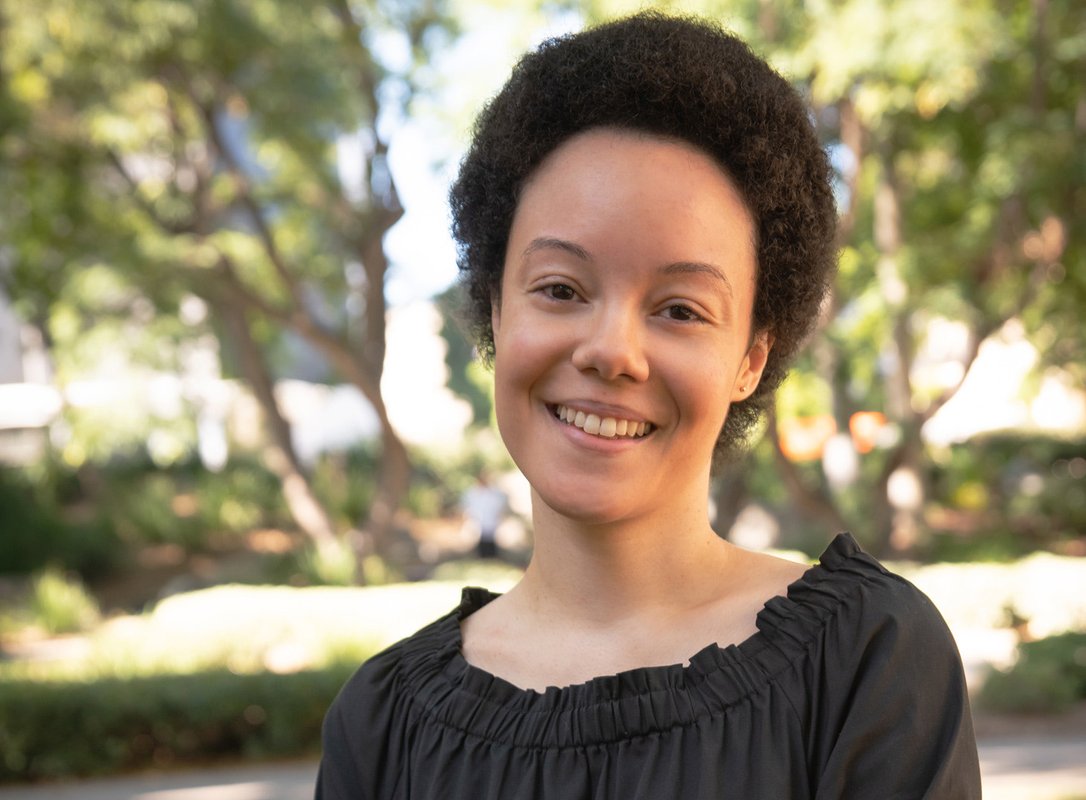 A portrait of Dana Murphy. Trees can be seen in the background.