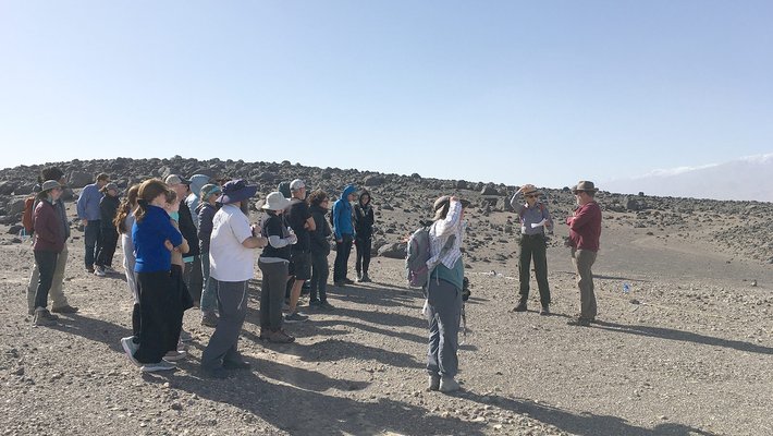 A park ranger and JPL astrobiologist Michael Tuite speak to a group in Death Valley National Park, near Mars Hill