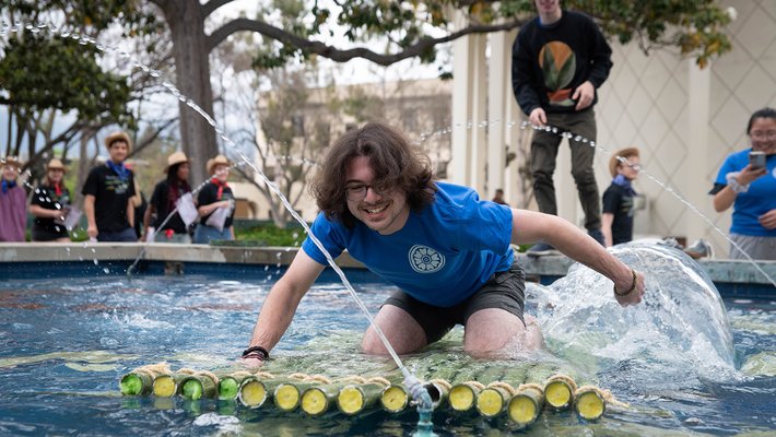 Third-year Joaquín Gómez paddles a raft across the Gene Pool.