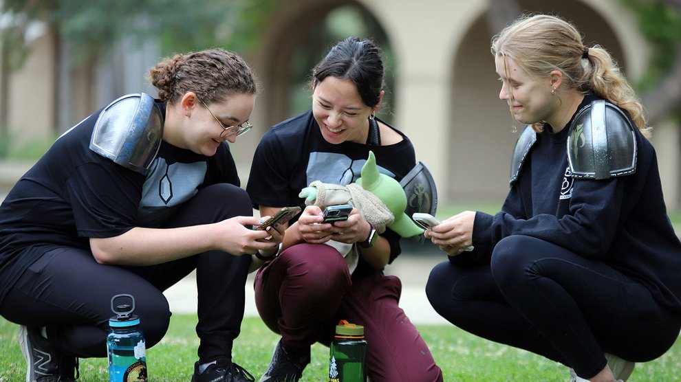 Students wearing custom Mandalorian armor (plus Grogu) participate in a scavenger hunt.