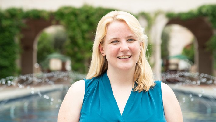 Lily Dove standing in front of the Caltech reflection pool.