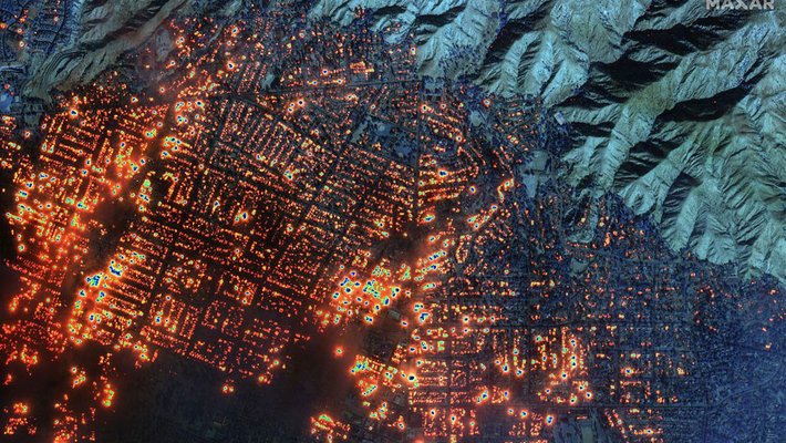 A composite satellite image of the Eaton fire burning in Altadena, California