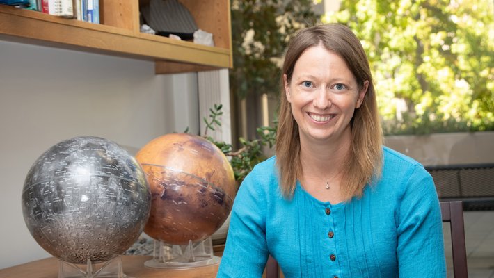 Image of Bethany Ehlmann in office wearing blue shirt.