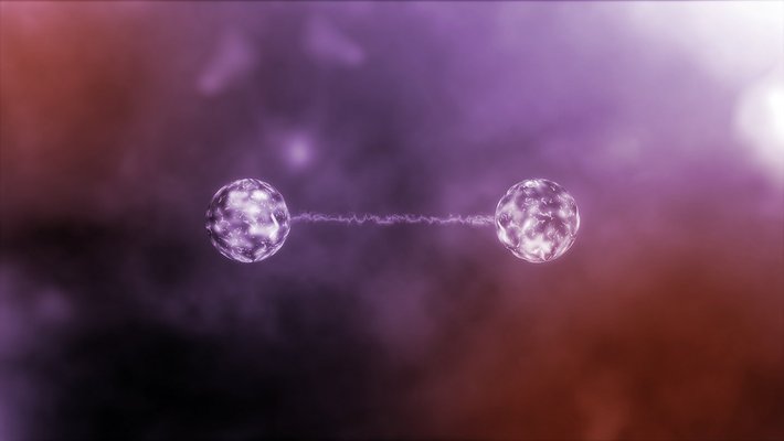 Purple filtered image of two particles connected with a glowing line