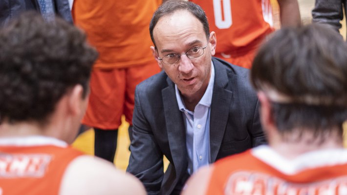 Coach Doc Eslinger coaching his basketball team during a game.
