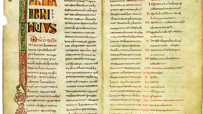 An example of a manuscript from the early Middle Ages. The lettering is done in elaborate caligraphy and the paper is very aged.