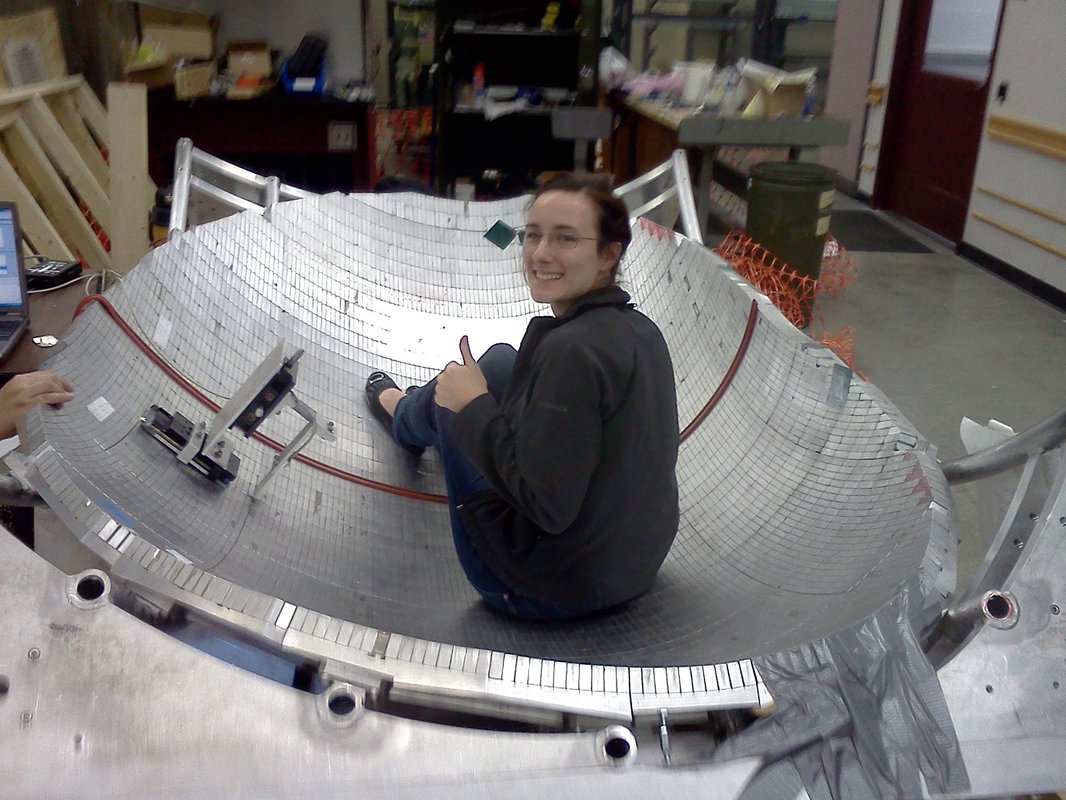 A student is seen working inside one of the neutron traps, or "bottles."