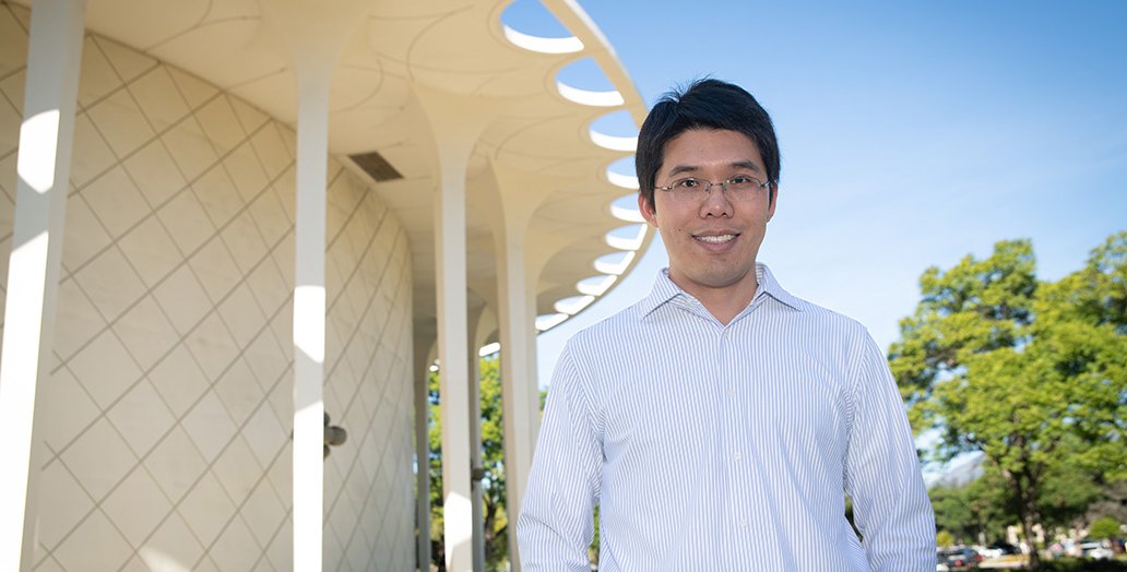 Image of professor Wei Gao in front of Beckman Auditorium