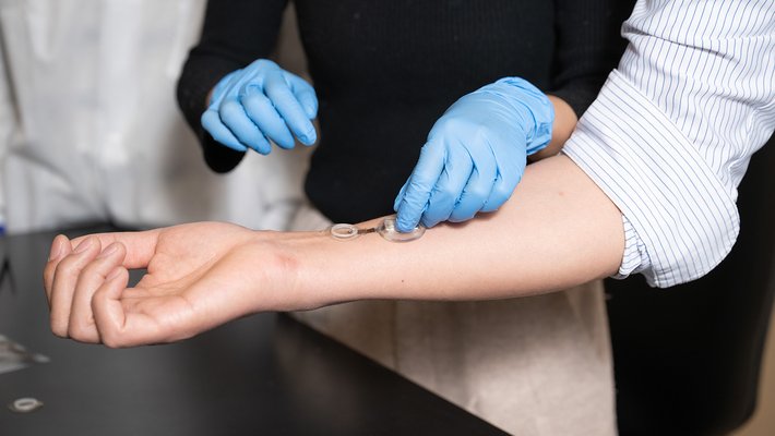 Arm with smart bandage on it