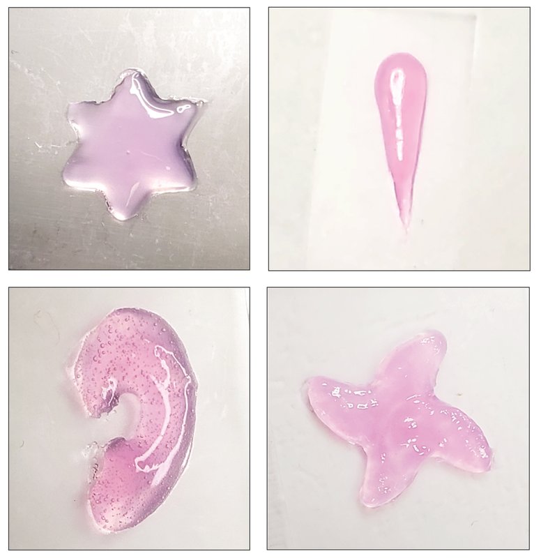 Four pink, gel-like shapes are pictured: a six-pointed star, something like an exclamation mark, a pinwheel, and an ear-like structure.